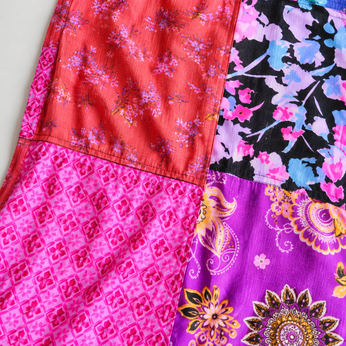 Floral and geometric cotton patchwork seam detail