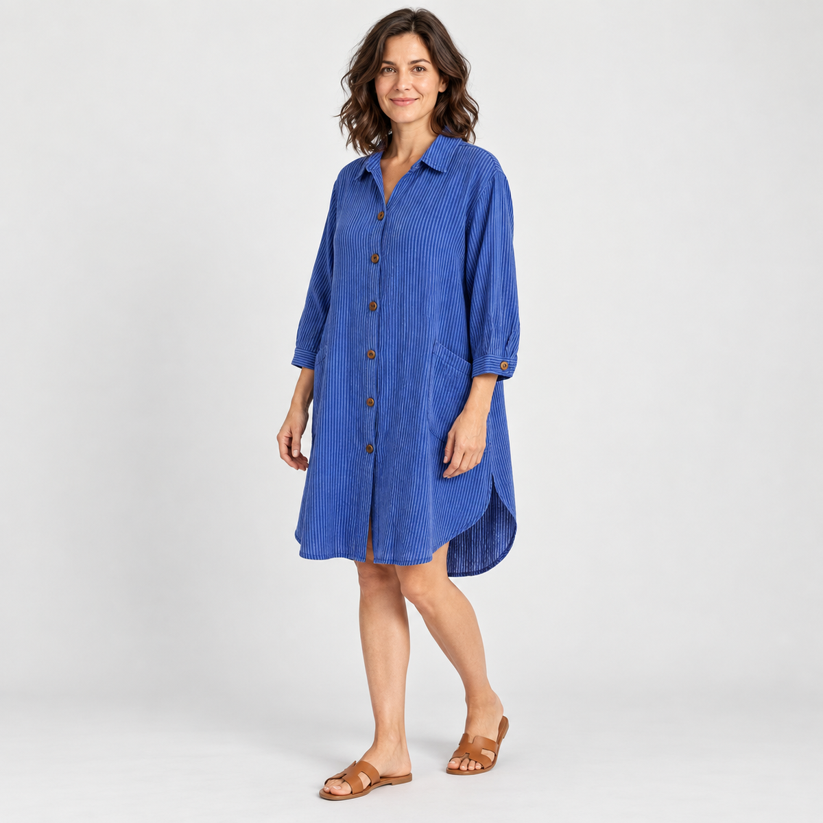 Model wearing blue pinstripe cotton high-low tunic shirt