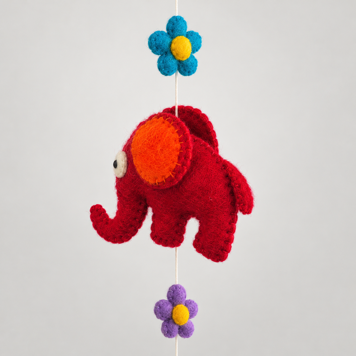 Red felt elephant with orange ear and flower detail