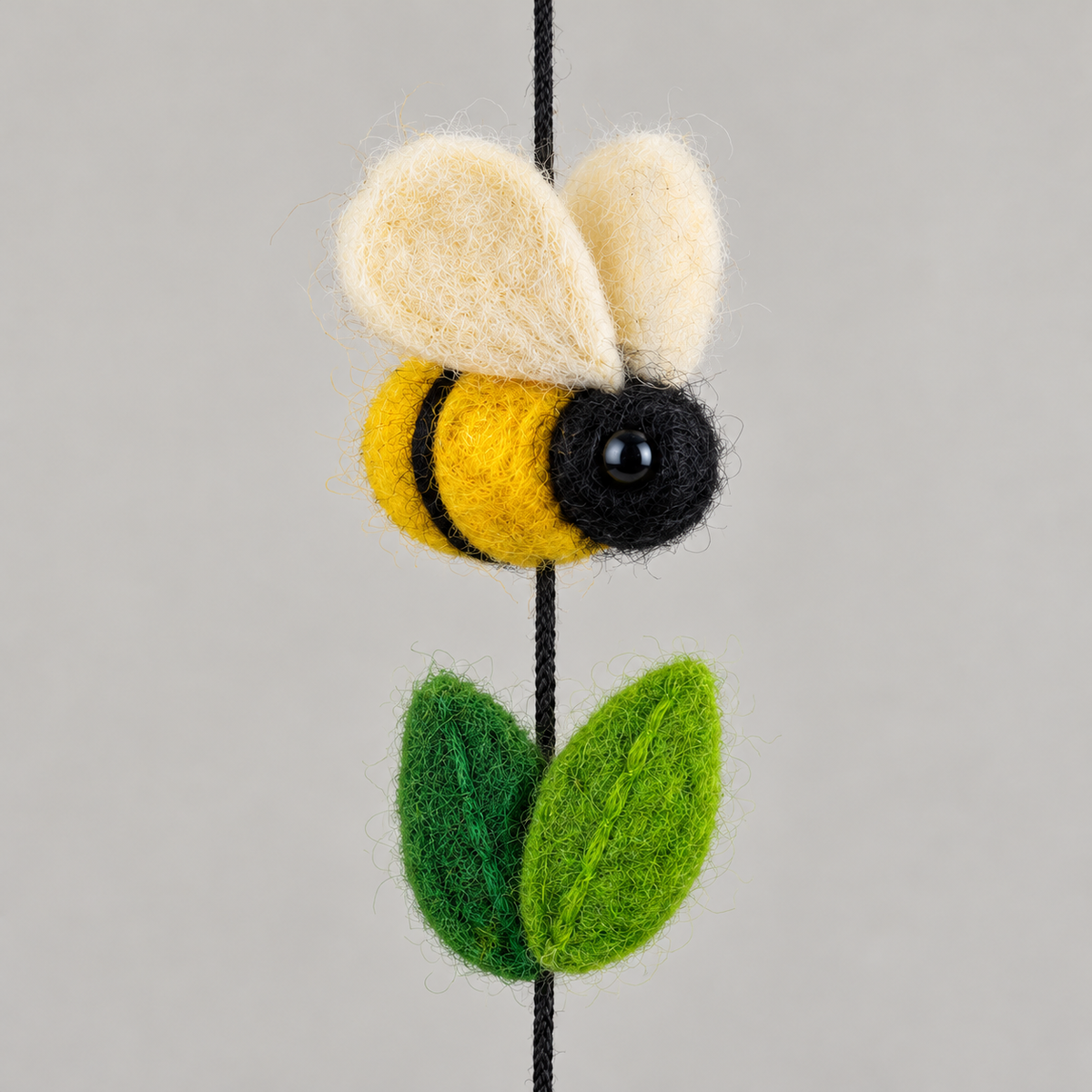 Close-up of wool bee wings and green leaf texture