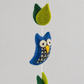 Blue wool owl detail with cream eyes and patterned belly