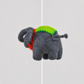 Gray wool elephant with green saddle detail