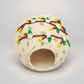 CC102 cream wool cat cave with floral felt branches on warm gray background.