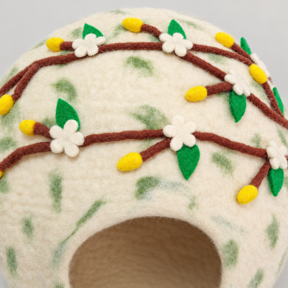 CC102 raised felt floral branch details.