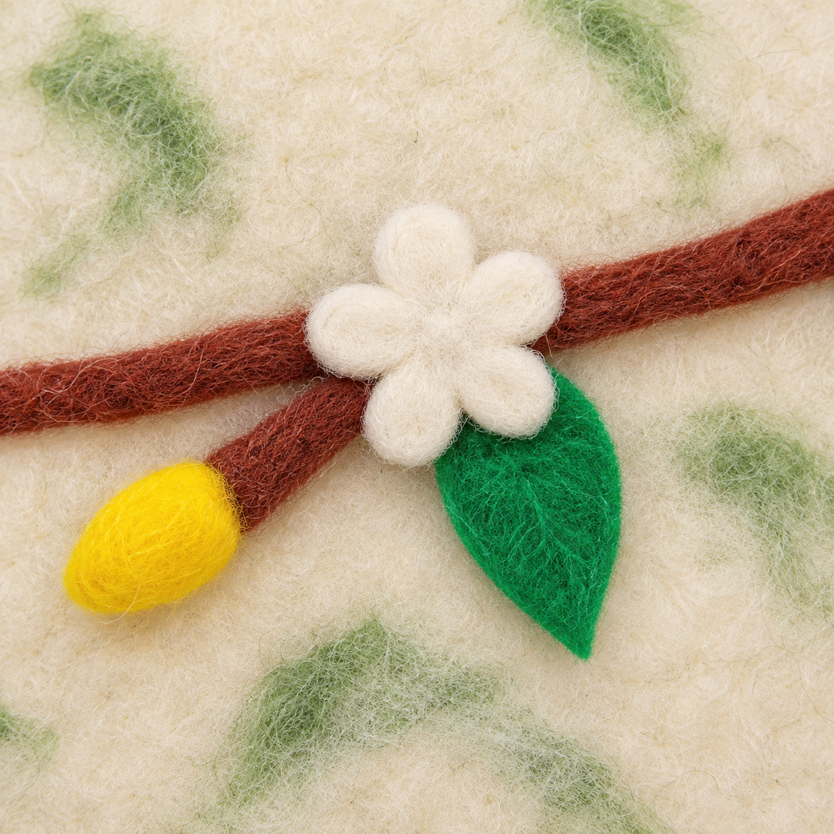 CC102 wool flower, green leaf and yellow bud close-up.