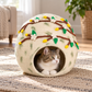 Natural tabby-and-white cat resting inside CC102 floral wool cat cave.