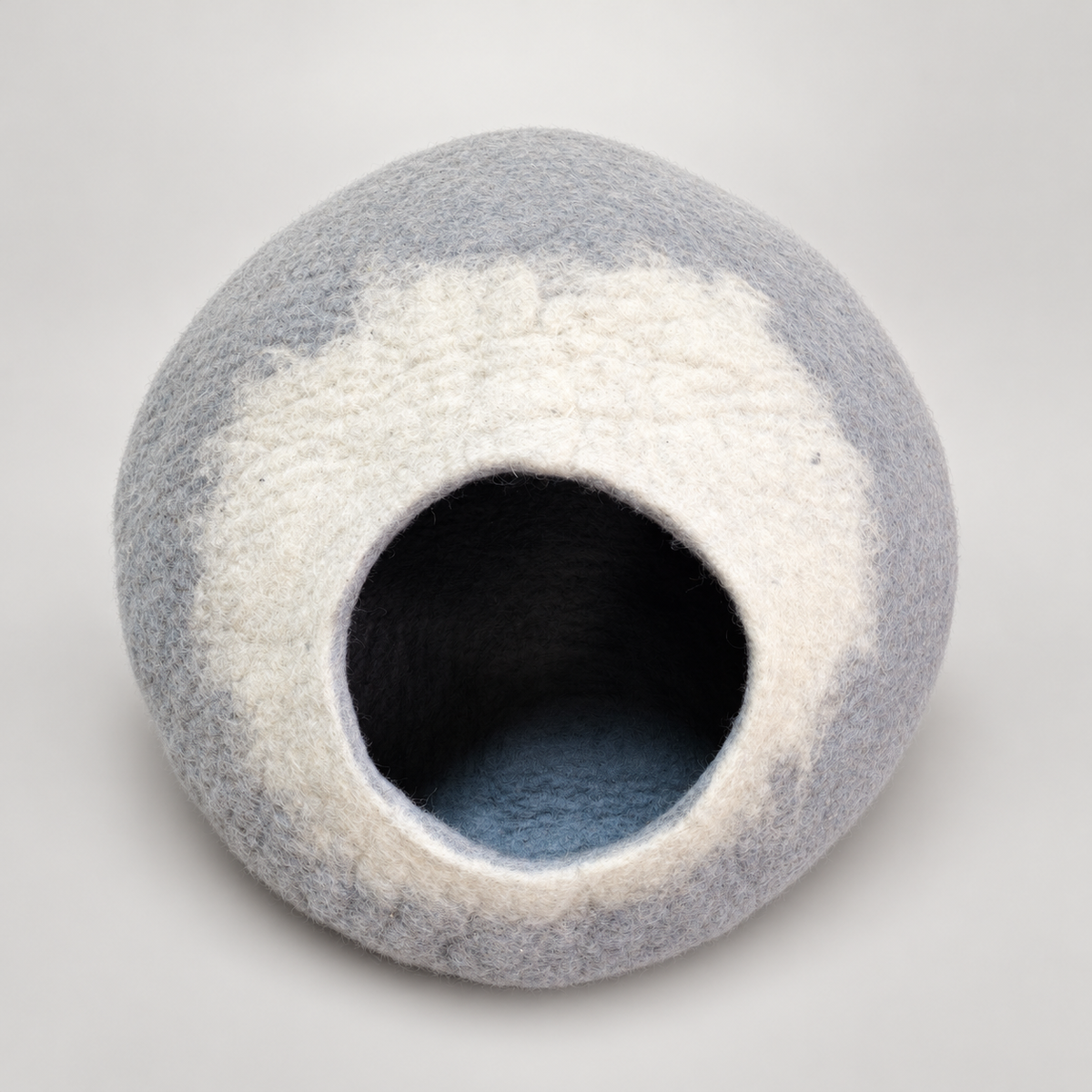 CC104 gray and white handmade wool cat cave on warm gray background