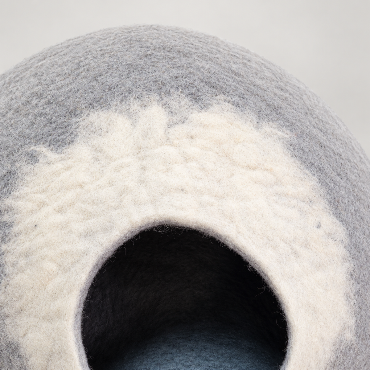 Close-up of CC104 white wool entrance arch and gray felt