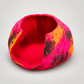 Pink and orange handmade wool cat cave with red interior and wide opening