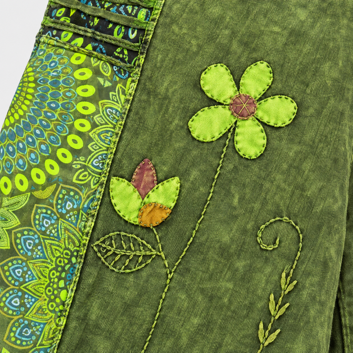 Floral applique and vine embroidery detail