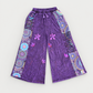 Purple floral cotton wide-leg pants with cleaned light-gray background