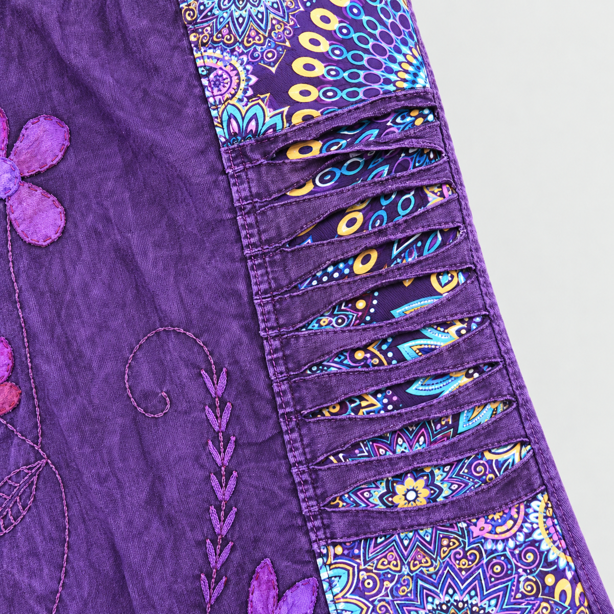 Multicolor patterned side panel and slash-cut fabric detail