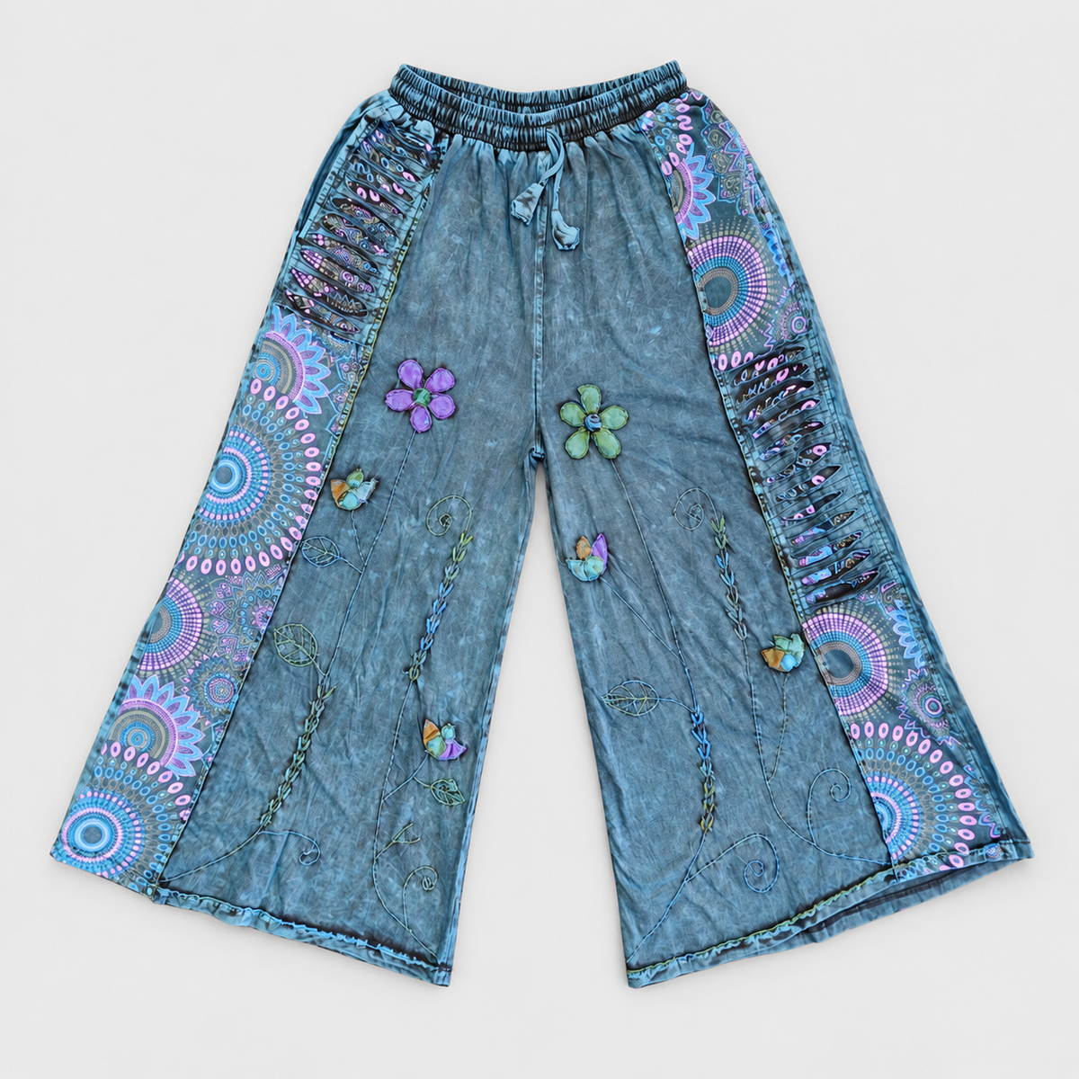 Washed blue floral cotton wide-leg pants on a clean light-gray background