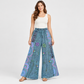 Model wearing washed blue floral cotton wide-leg pants