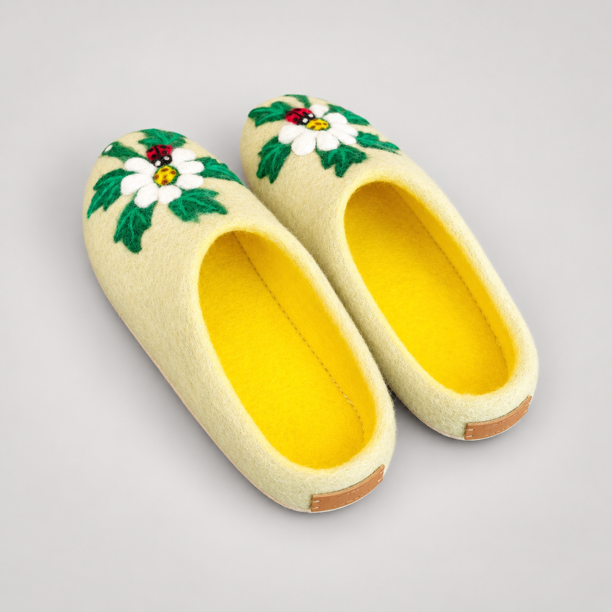 Clean yellow slipper interiors and rear heel view