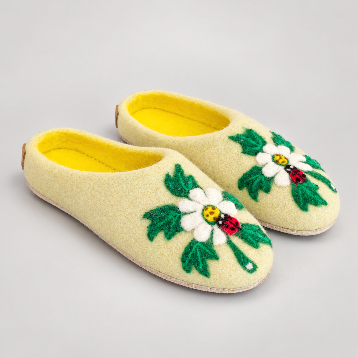Wool slipper side profile and stitched sole edge