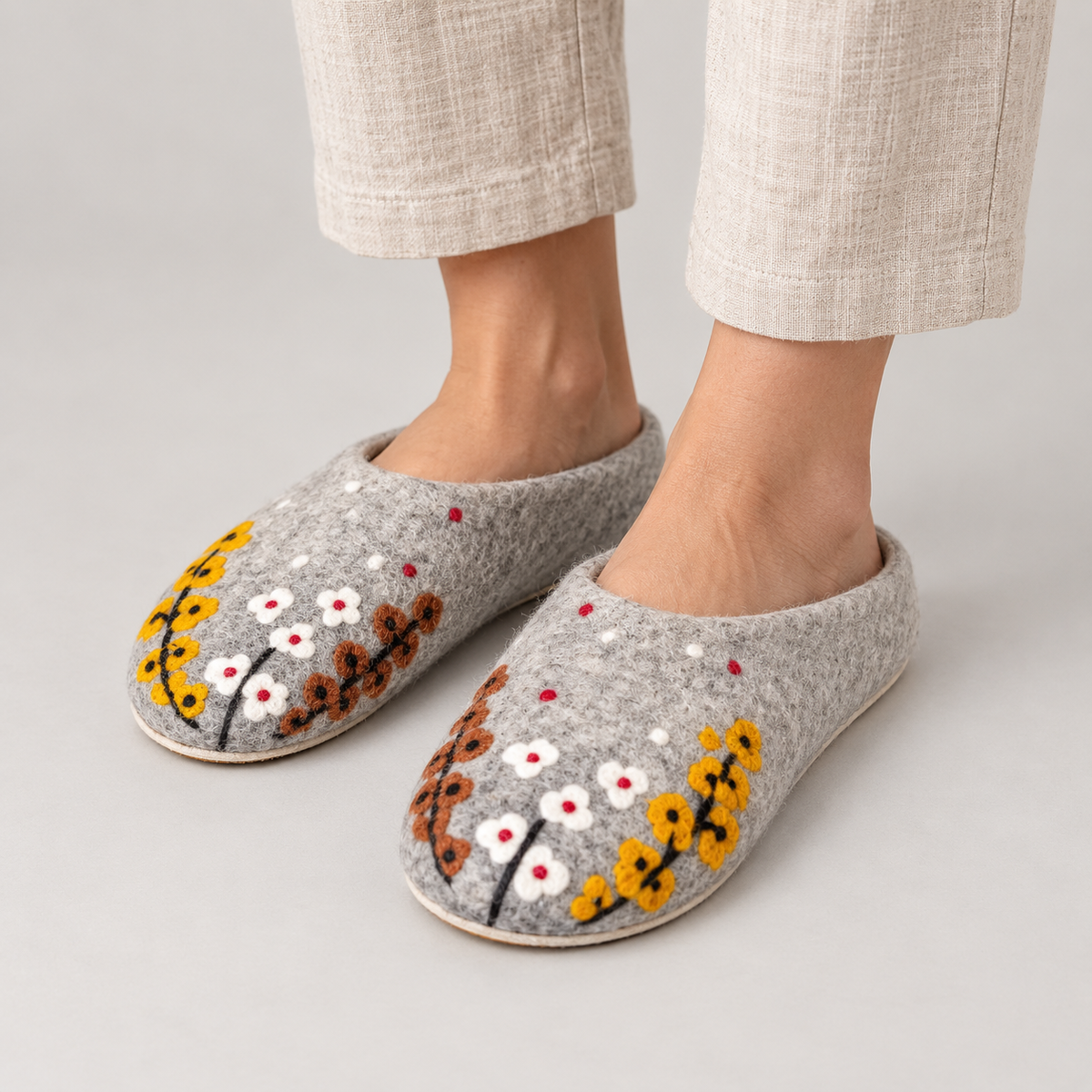 Model wearing gray botanical wool slippers