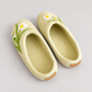 Pale green daisy wool slippers with clean interiors