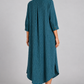 Teal pinstripe long shirt dress on model, back angle view