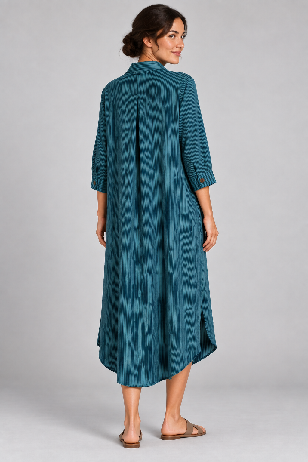 Teal pinstripe long shirt dress on model, back angle view