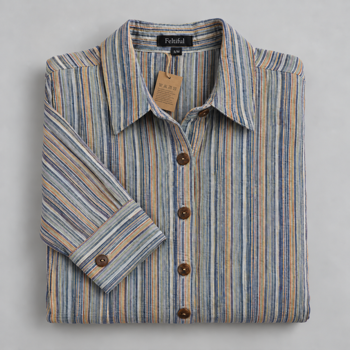 Folded striped dress with label, tag and two-hole brown buttons