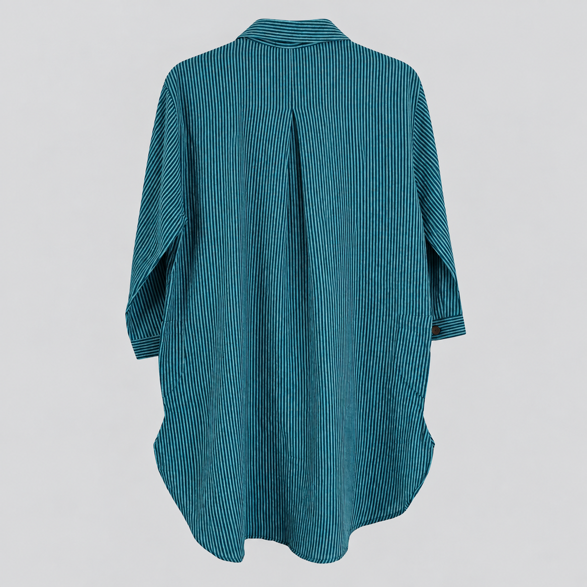 Back view of teal pinstripe cotton tunic showing center pleat and curved high-low hem, no hanger