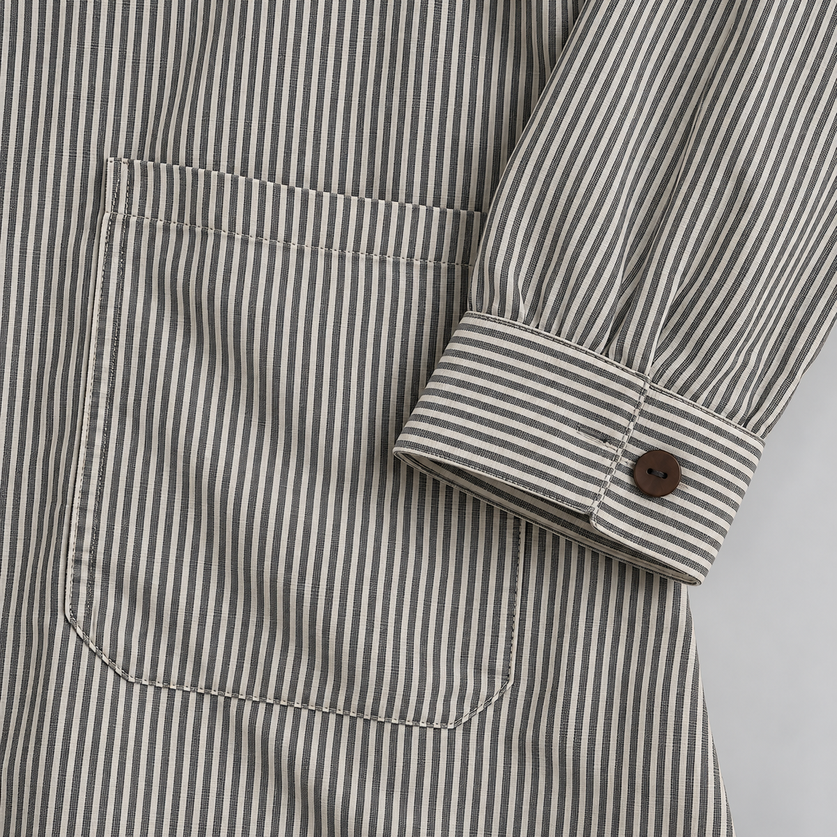 Charcoal pinstripe cotton high-low tunic shirt — cuff pocket detail
