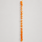 Full-length orange wool flower garland on warm gray