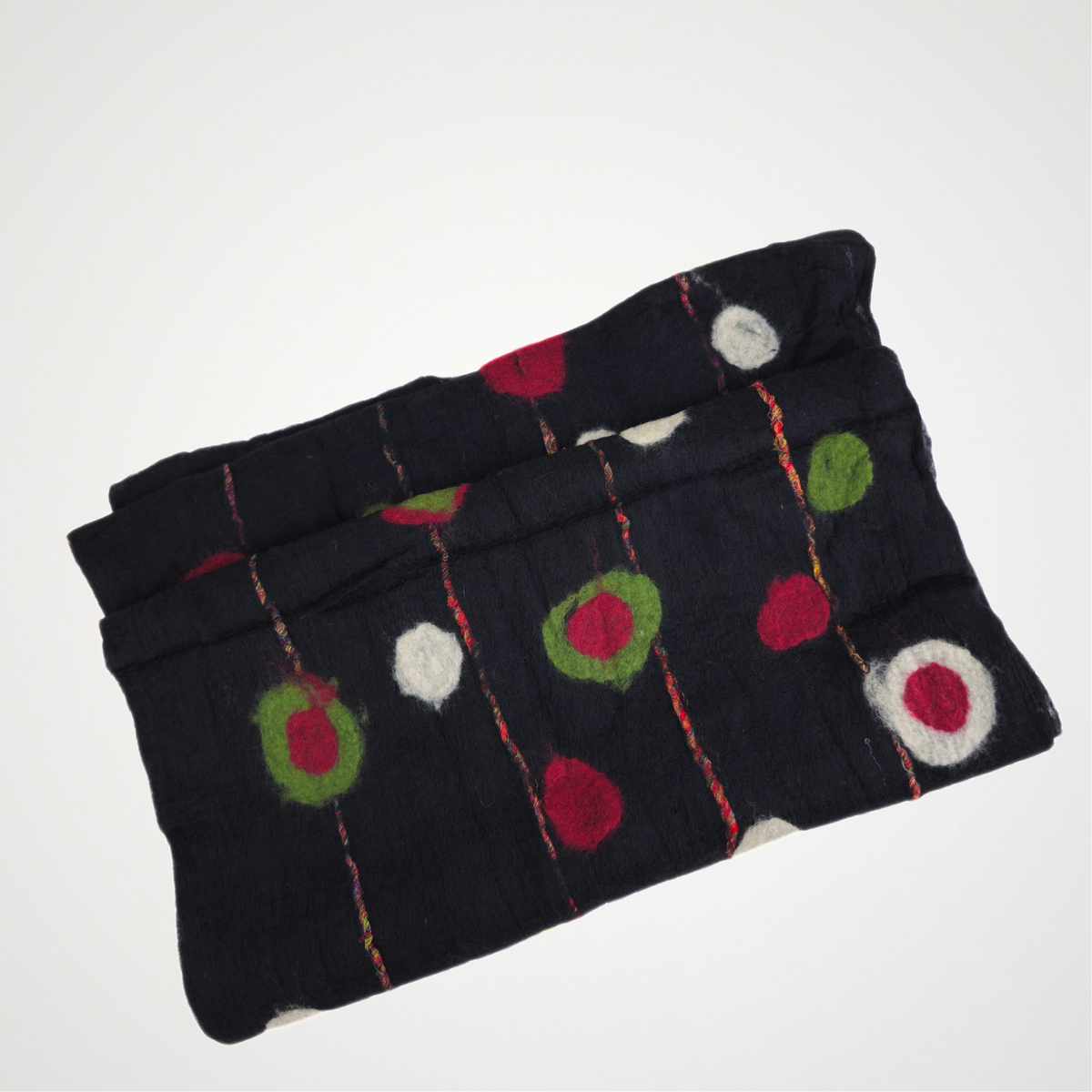 black scarf with red, green and ivory dots and fine red lines, folded detail