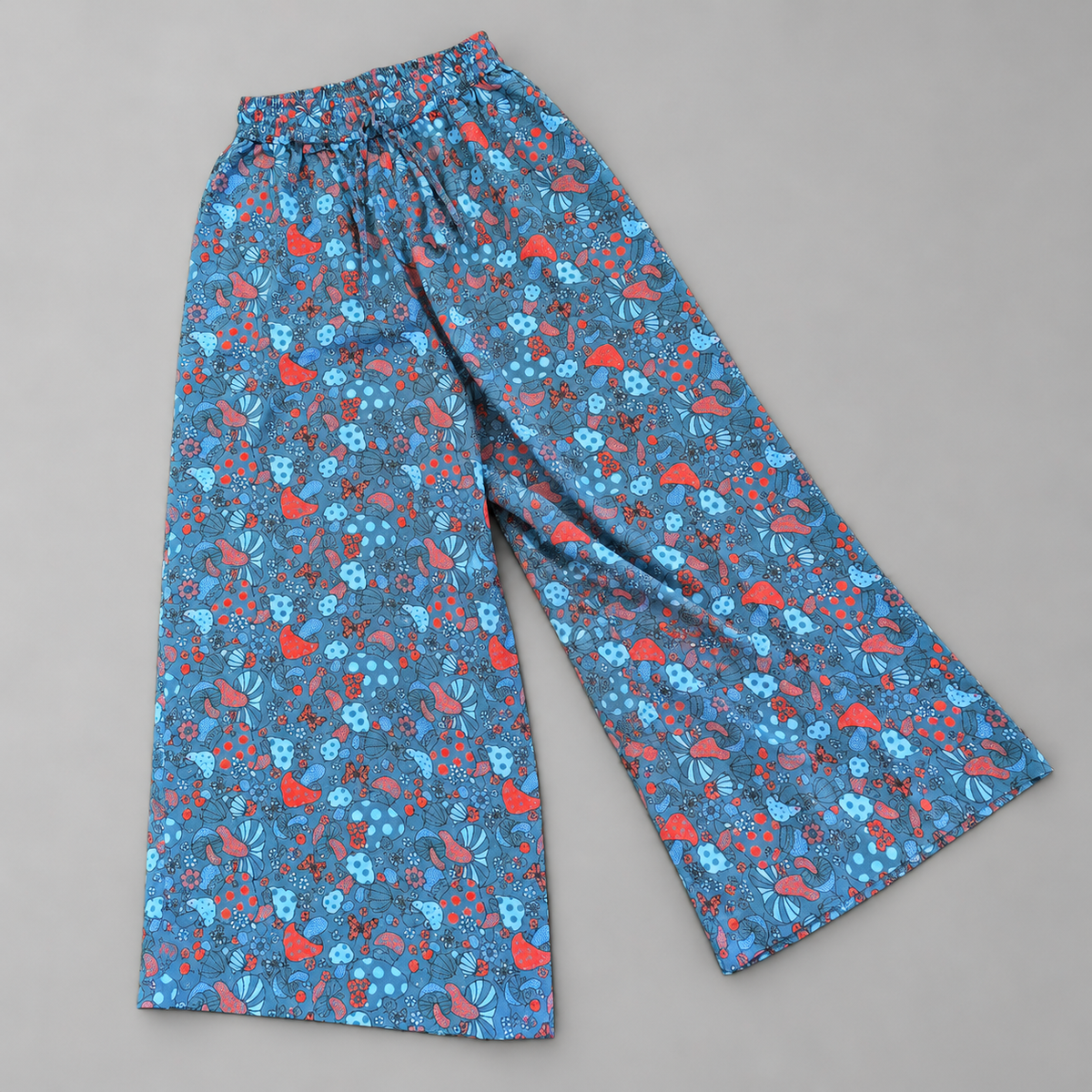 Blue and red mushroom print cotton palazzo trousers – angled arrangement