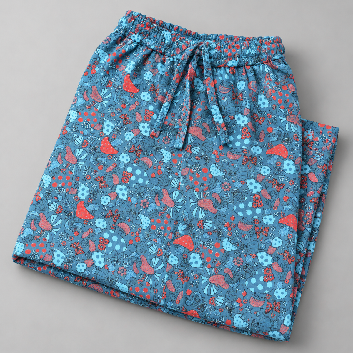 Blue and red mushroom print cotton palazzo trousers – folded detail