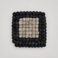 Coasters by Feltiful on a soft warm gray background