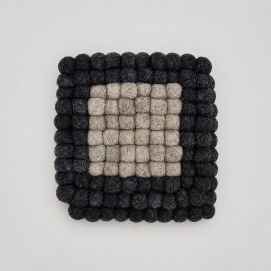 Coasters by Feltiful on a soft warm gray background