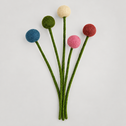 Felt flowers by Feltiful on a soft warm gray background