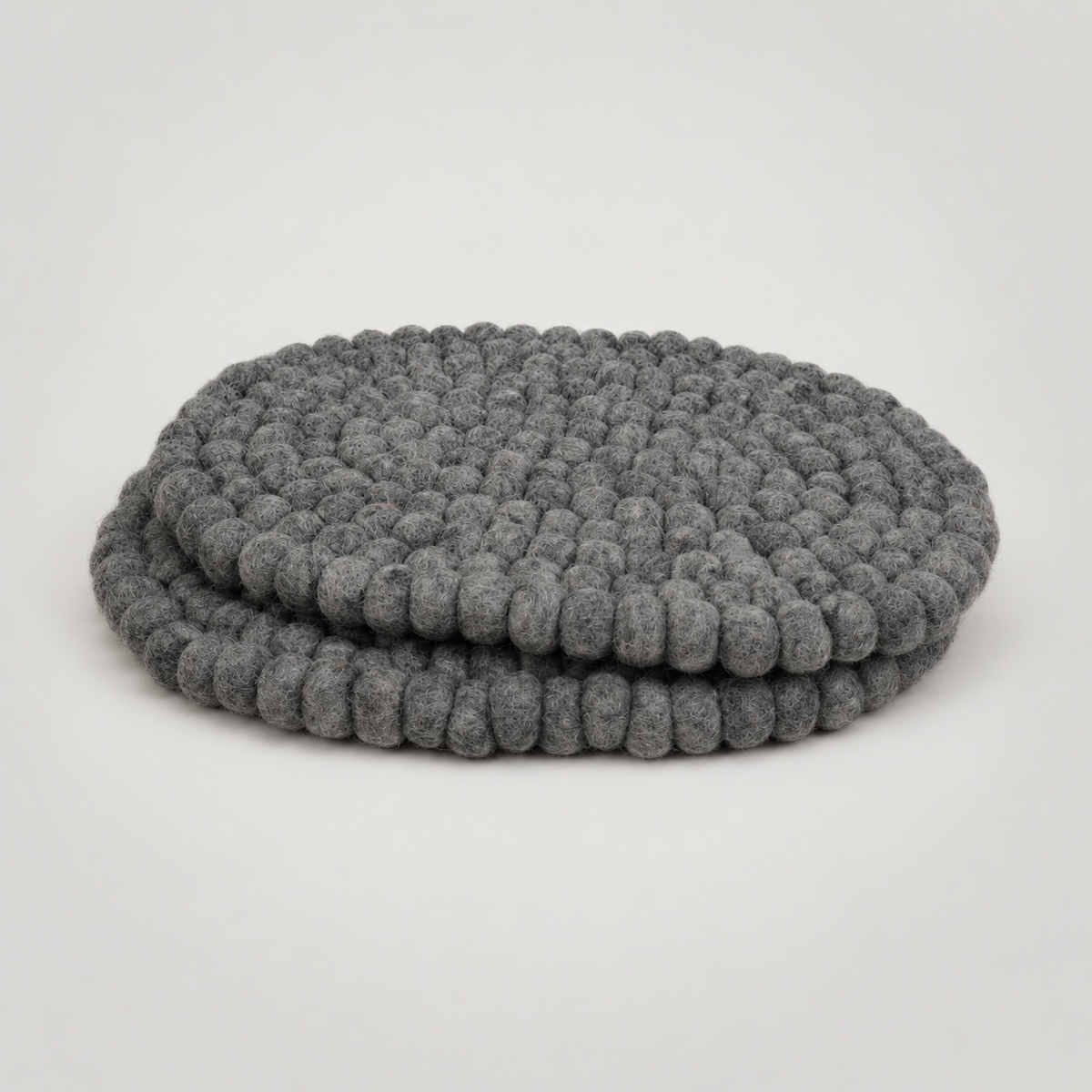 Placemats by Feltiful on a soft warm gray background