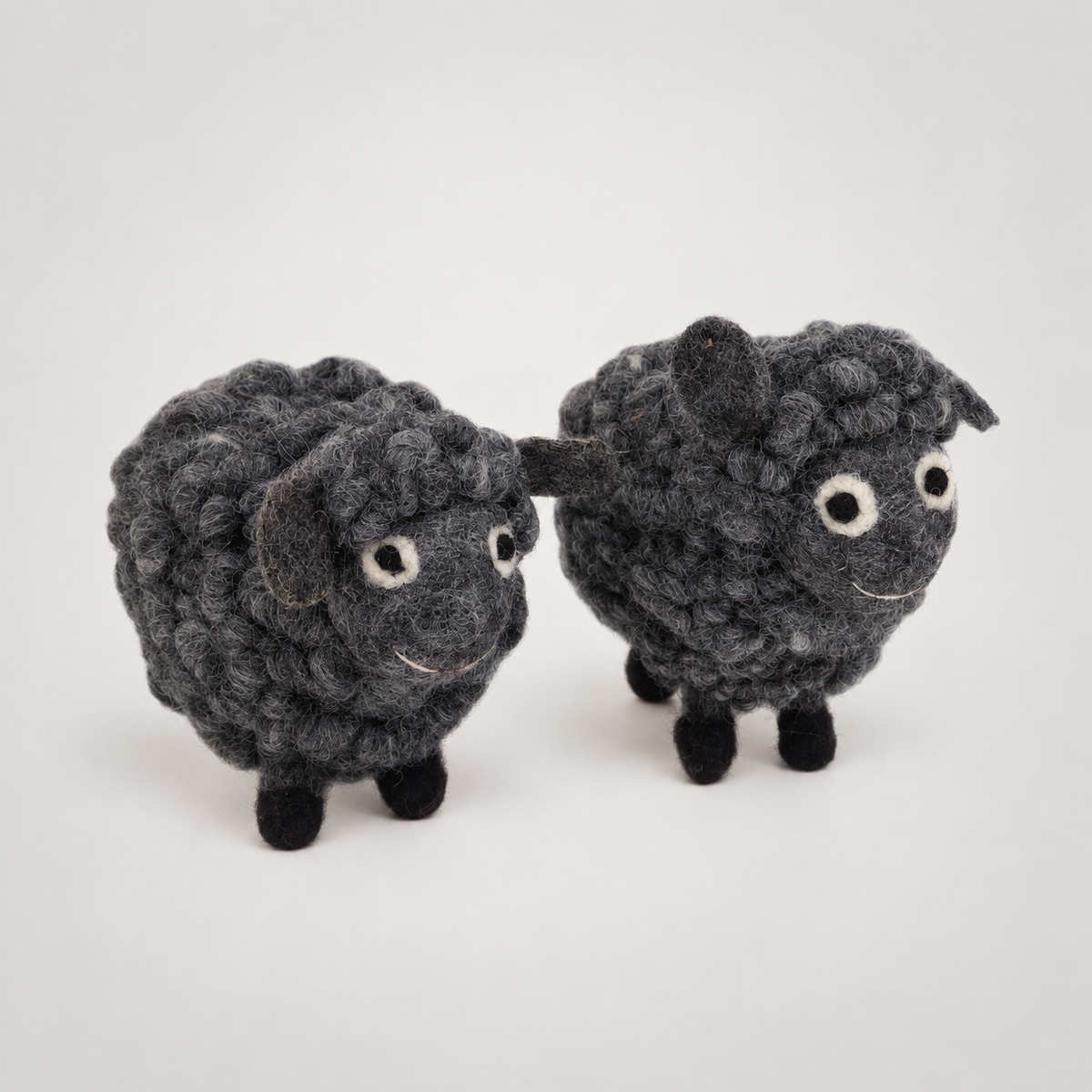 Felted Woolen Sheep-Grey on a soft warm gray background