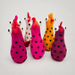 Felted Assorted Roster on a soft warm gray background