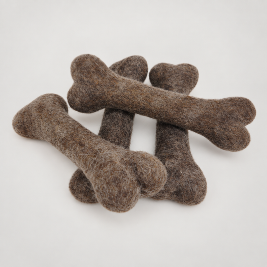 Felted Bone, Dog Toys on a soft warm gray background