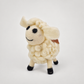 Felted Woolen Sheep-White on a soft warm gray background