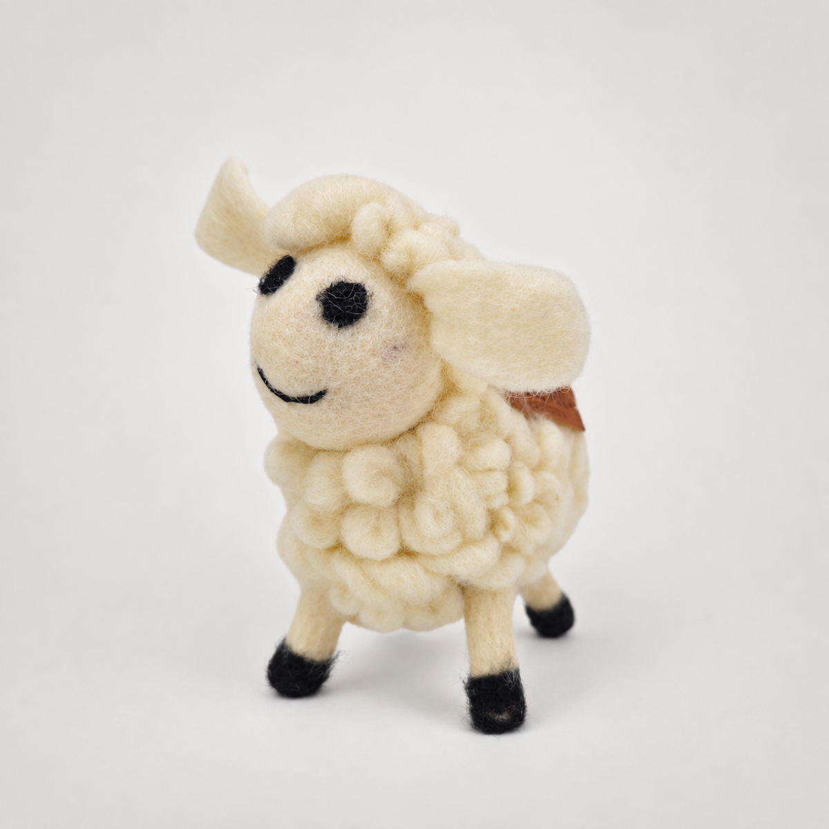 Felted Woolen Sheep-White on a soft warm gray background