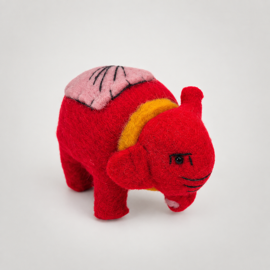 Hand Felted Small Elephant on a soft warm gray background