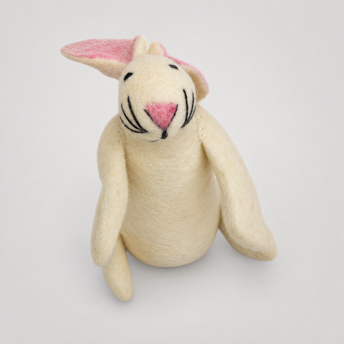 Hand Felted White Bunny on a soft warm gray background