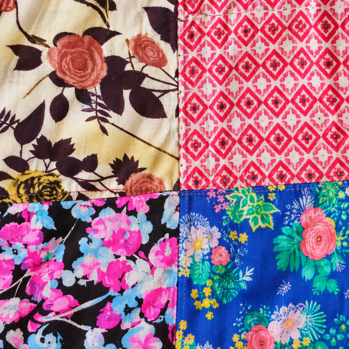 Floral and geometric cotton patchwork and seam detail