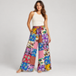 Woman wearing floral patchwork cotton pants with one hand in a pocket