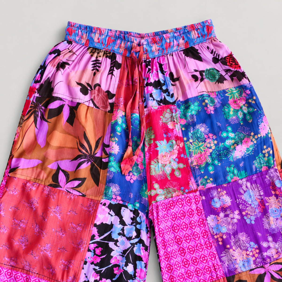 Blue and pink elastic waistband and drawstring detail