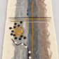 Close-up of spiral sun and line details on felt wool runner
