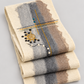 Folded felt wool runner showing design and layers