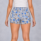 Mushroom Print Cotton Shorts in White, back view on model