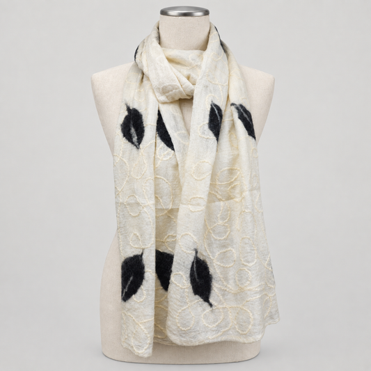 Scarf displayed on a cream mannequin with a soft gray studio background