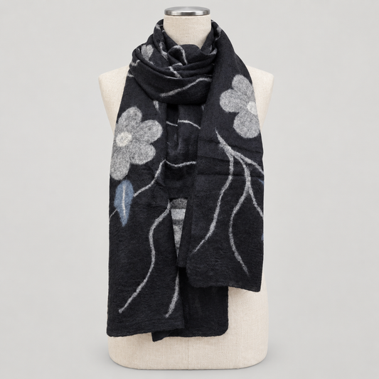 Scarf displayed on a cream mannequin with a soft gray studio background